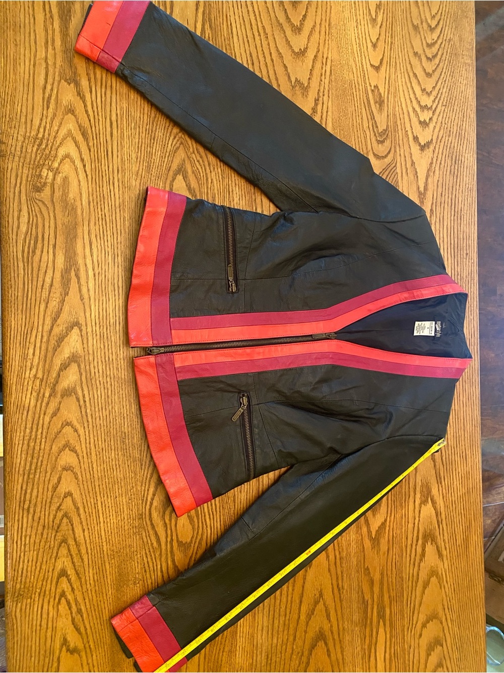 Vintage metrostyle Black Leather Jacket with Pink and orange/red trim.
